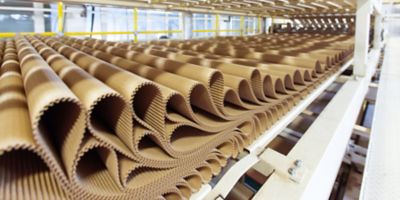 Closeup image of pleat cardboard row at factory background.