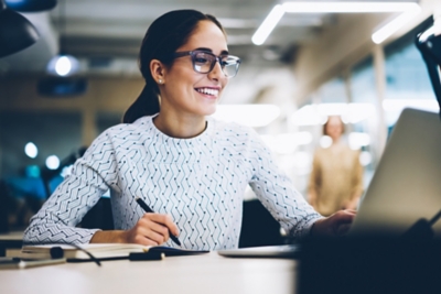 Cheerful businesswoman excited with accomplished project.