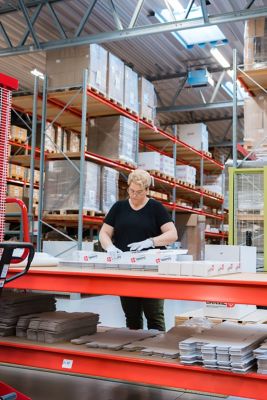 Employee packaging the product in the facility warehouse.