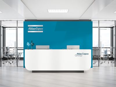 Reception branding with a logotype cutout in the background in blue
