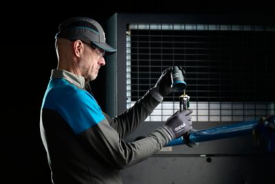 Service technician opening a SMART AIRnet sensor mounted on airnet tube