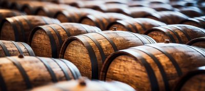 Scottish distilleries whiskey barrels on a production line.