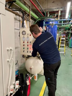 Image of a service tech at work.
