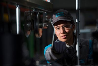 Female service technician working on site