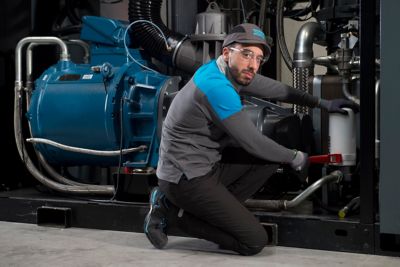 Male service technician working on site