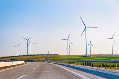 Image of wind mills by the side of the road