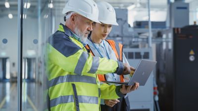 Engineers using laptop in the filed