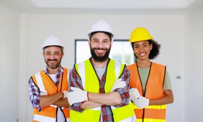 Tradespeople men and woman working in an apartment for reference