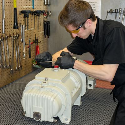 Man servicing dry pump