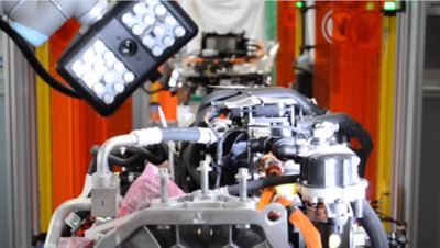Automated cameras and lights system guiding manufacturing