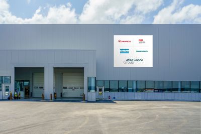 Facade of a facility showing logotypes of Group and other Group brands on the facade