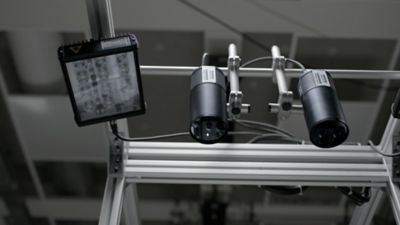 Cameras and lights system guiding manufacturing