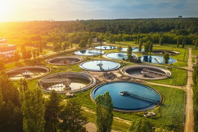 Aerial view of modern industrial sewage treatment plant at sunset.