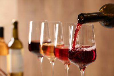 Pouring wine from bottle into glass