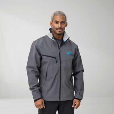Man wearing a gray Atlas Copco jacket