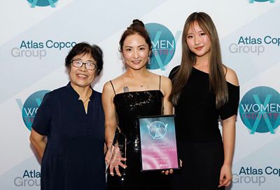 Group of people smiling at camera at awards evening