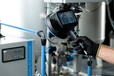 Service Engineer performing a ComPASS audit with an acoustic camera. 
