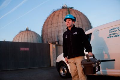 Service technician with toolbox at petrochemical plant