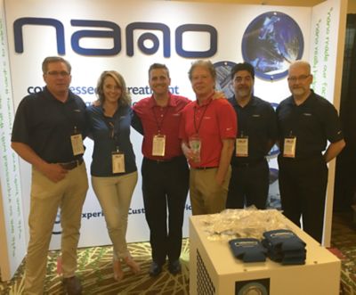 Association tradeshow with employees on booth