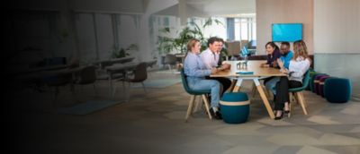 employees sitting around a table in the office