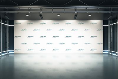 A large logo backdrop with Atlas Copco Group logotype printed in a regular pattern on white