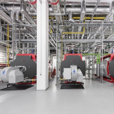 Three permanent hot water boilers in an industrial setting. It are Bosch UT-M boilers.