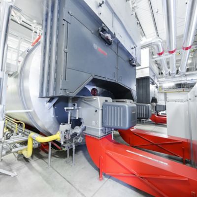 Two high-capacity Bosch steam boilers working in parallel and installed in a boiler room.
