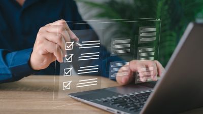 Electronic smart checklist and document on virtual screens concept, business people check electronic documents on digital documents, paperless offices,working on borderless communication technology