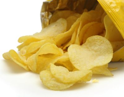 opened potato chip bag with chips spilling out