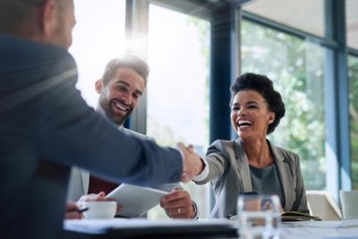 business people shaking hands in the office for a deal.