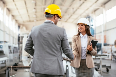 Project manager meeting customer at production site
