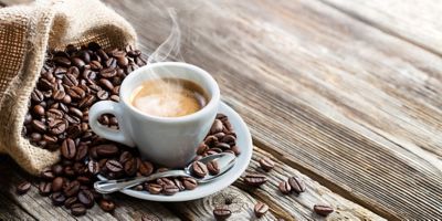 Image of coffee in cup and coffee beans