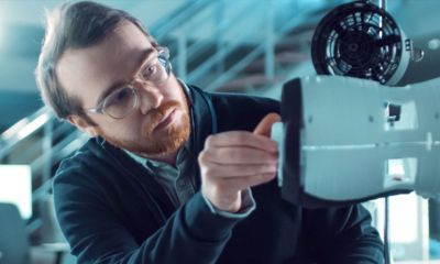 Technician controlling a piece of equipment.