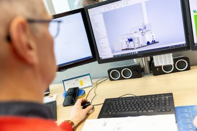 Close-up of a project engineer designing a steam solution for a client on a computer. 