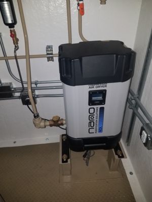 nano modular desiccant dryer located inside a doghouse for the oil and gas industry