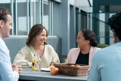 Employees catching up for healthy snack