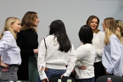 Girls in a group trying to solve a problem together