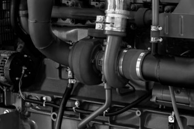 Black diesel engine. Fragment of a diesel motor close-up. Selective on the fuel injection in the the diesel engine. supply system for diesel fuel.  Engine details  Diesel engine  background