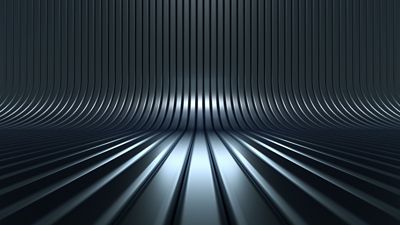 Metallic surface with horizontal ribbing that extends toward a vanishing point, giving a horizon-like effect. The light fades into darkness, creating depth.