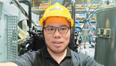 Hua Sheng Wei wearing a hardhat.