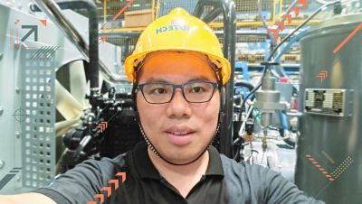 Hua Sheng Wei wearing a hardhat.