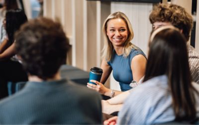 Woman employee in discussion with colleagues 
