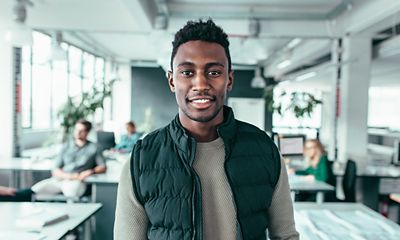 Employee smiling at the camera.