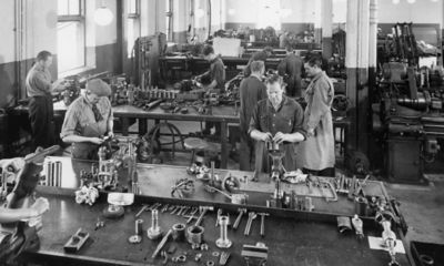 Historical image of workers in a factory.