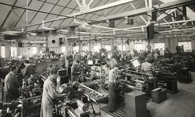 Historical image of workers in a factory.