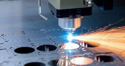 A laser cutting machine with sparks coming off