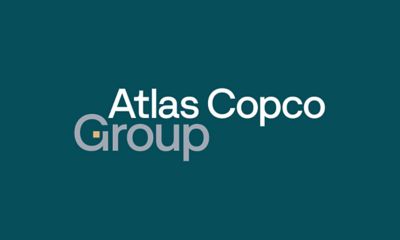 Group logotype in a teal box