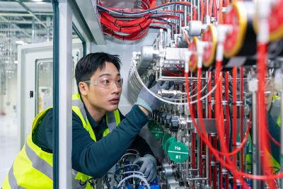 An employee inspecting a machine.