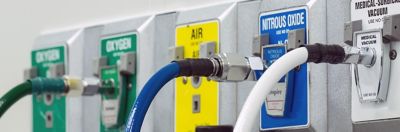 A panel of different lab gas inputs, including oxygen, air, nitrous oxide, and medical vacuum