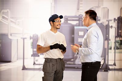 Meeting service technician in the compressor room